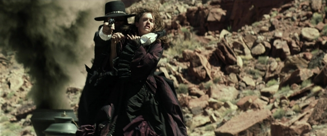 Wide shot frame from The Lone Ranger — sitting, standing, hat