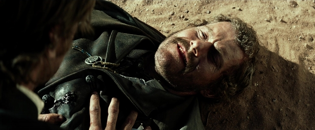 Wide shot frame from The Lone Ranger — coat, beard, mustache