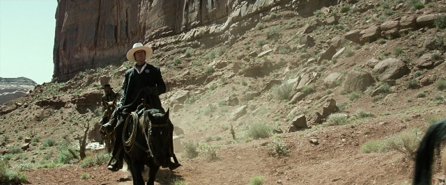 Frame from The Lone Ranger — sitting, walking, hat