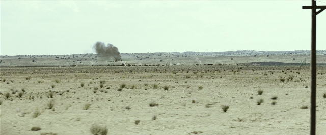 Frame from The Lone Ranger — phone, fire, smoke
