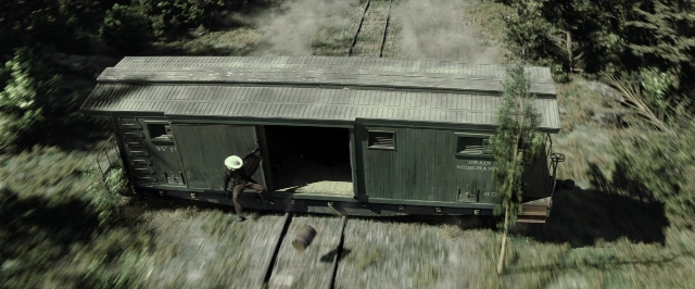 Frame from The Lone Ranger — standing, hat, car
