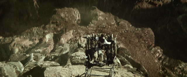 Wide shot frame from The Lone Ranger — sitting, table, dialogue