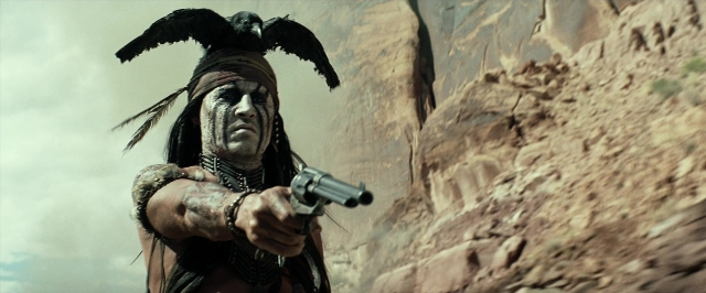 Wide shot frame from The Lone Ranger — standing, hand, gun