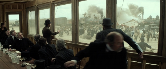 Wide shot frame from The Lone Ranger — standing, walking, room