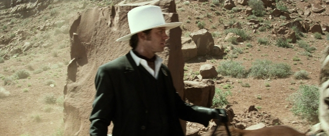 Frame from The Lone Ranger — standing, hat, coat