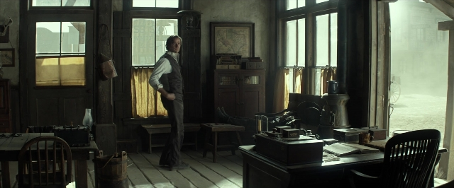 Frame from The Lone Ranger — standing, room, table