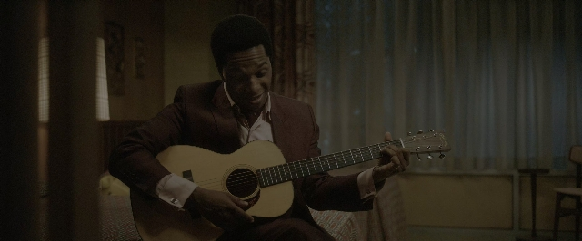 Wide shot frame from One Night in Miami — sitting, room, table