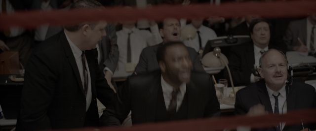 Wide shot frame from One Night in Miami — sitting, room, table