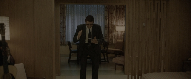 Wide shot frame from One Night in Miami — standing, room, bed