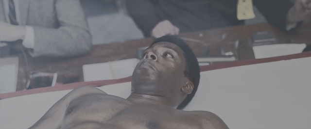 Wide shot frame from One Night in Miami — sitting, table, bed