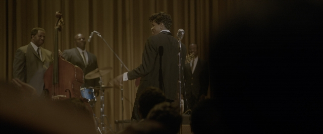 Wide shot frame from One Night in Miami — standing, dialogue, suit