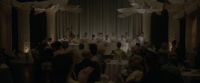 Wide shot frame from One Night in Miami — sitting, standing, room