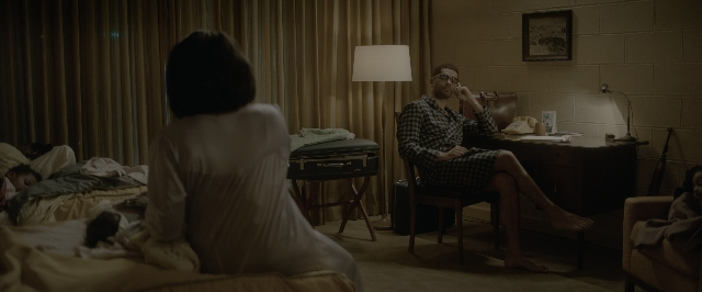 Wide shot frame from One Night in Miami — sitting, room, table