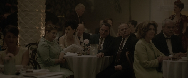 Wide shot frame from One Night in Miami — sitting, standing, room