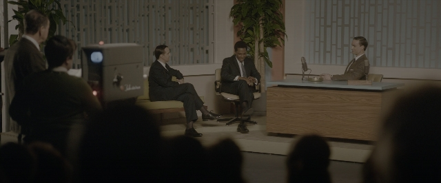 Wide shot frame from One Night in Miami — sitting, room, table