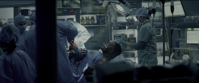 Wide shot frame from Bad Boys for Life — standing, room, bed