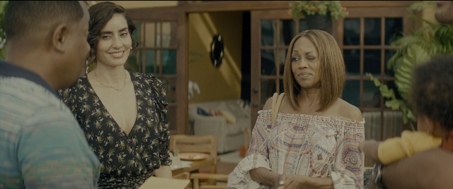 Wide shot frame from Bad Boys for Life — standing, room, table