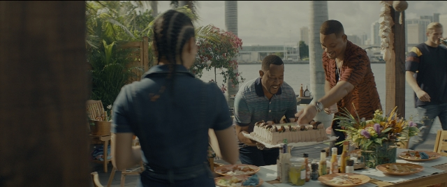 Wide shot frame from Bad Boys for Life — table, shirt, person