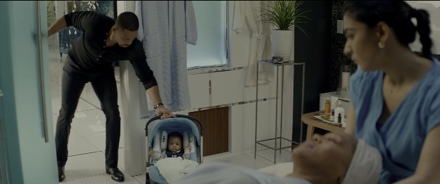 Wide shot frame from Bad Boys for Life — sitting, standing, room