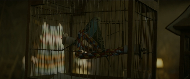 Wide shot frame from Bad Boys for Life — room, lamp, bird