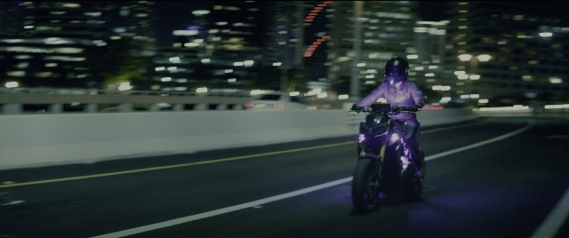 Wide shot frame from Bad Boys for Life — street, hat, car