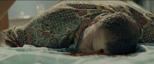 Wide shot frame from Bad Boys for Life — bed, bedroom, person