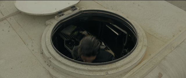 Wide shot frame from Bad Boys for Life — hand, shirt, person