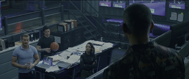 Wide shot frame from Bad Boys for Life — sitting, standing, room