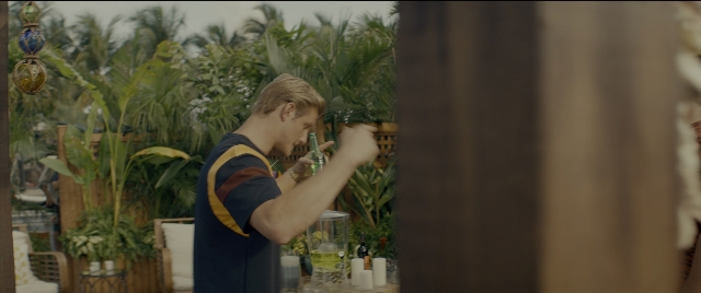 Wide shot frame from Bad Boys for Life — standing, table, hand