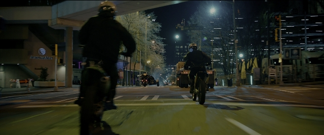 Wide shot frame from Bad Boys for Life — street, hat, car