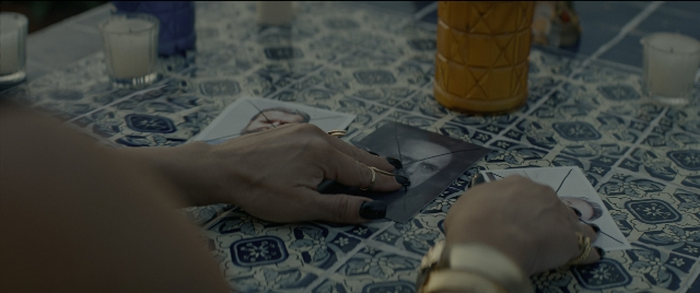 Wide shot frame from Bad Boys for Life — table, water, face