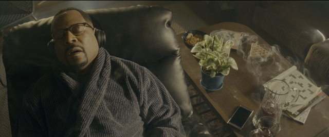 Wide shot frame from Bad Boys for Life — sitting, plate, room