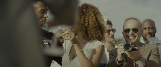 Wide shot frame from Bad Boys for Life — uniform, camera, glass