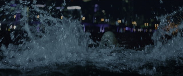 Wide shot frame from Bad Boys for Life — night, water, fountain
