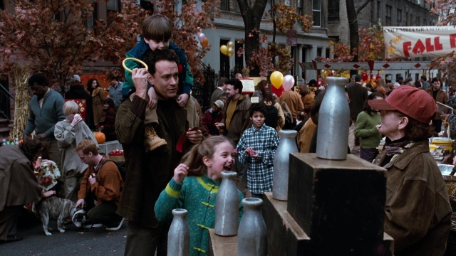 Wide shot frame from You've Got Mail — standing, walking, table