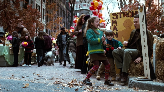 Wide shot frame from You've Got Mail — sitting, walking, street