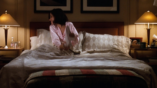 Wide shot frame from You've Got Mail — sitting, room, bed