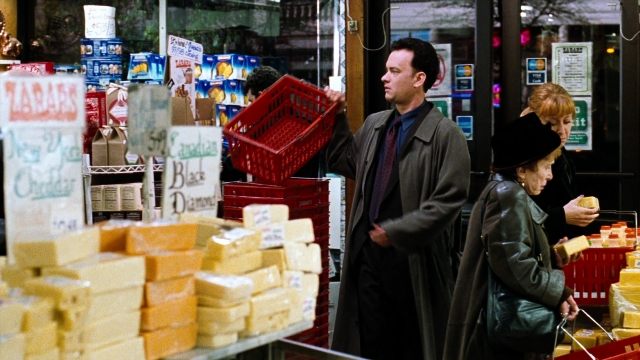 Wide shot frame from You've Got Mail — standing, door, coat