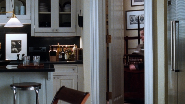 Wide shot frame from You've Got Mail — walking, bowl, bottle