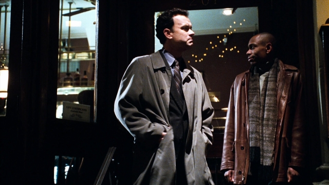 Wide shot frame from You've Got Mail — standing, room, coat