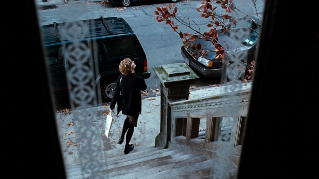 Wide shot frame from You've Got Mail — walking, street, car