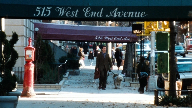 Wide shot frame from You've Got Mail — walking, street, dog