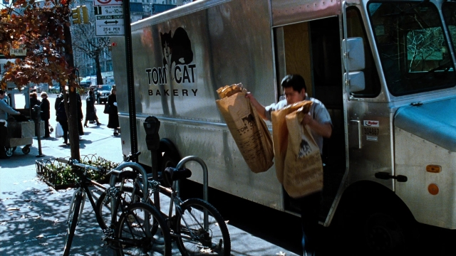 Wide shot frame from You've Got Mail — standing, walking, street