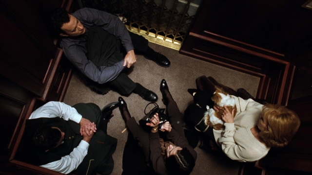 Wide shot frame from You've Got Mail — room, dog, person