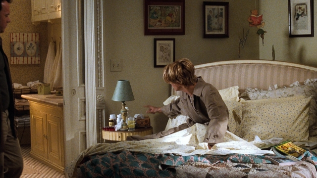 Frame from You've Got Mail — sitting, standing, room