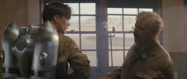 Wide shot frame from The Rocketeer — standing, room, dialogue