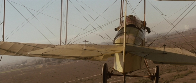 Wide shot frame from The Rocketeer — airplane, wheel