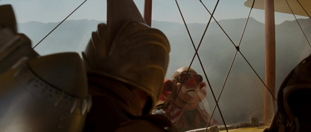 Frame from The Rocketeer — hat, hand, gun