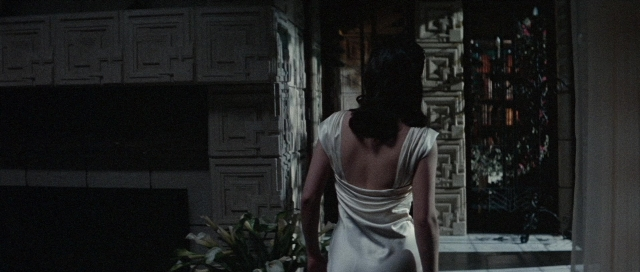 Frame from The Rocketeer — standing, room, dress