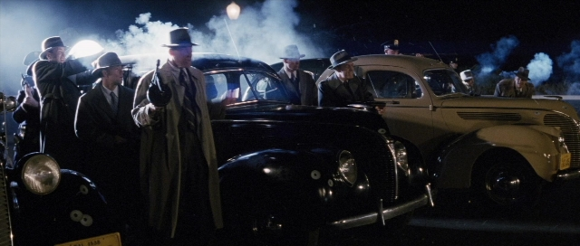 Frame from The Rocketeer — standing, street, car
